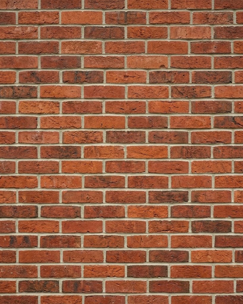 Freshly repointed red-brick wall — replace with a photo of Scott